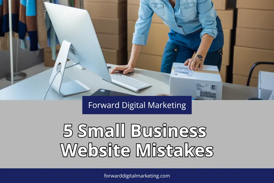 businessperson standing in front of a computer at a work desk